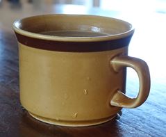 White cup of coffee with foam on top