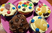 Group of frosted cupcakes with sprinkles