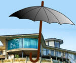 Two hands holding a paper house under a protective umbrella